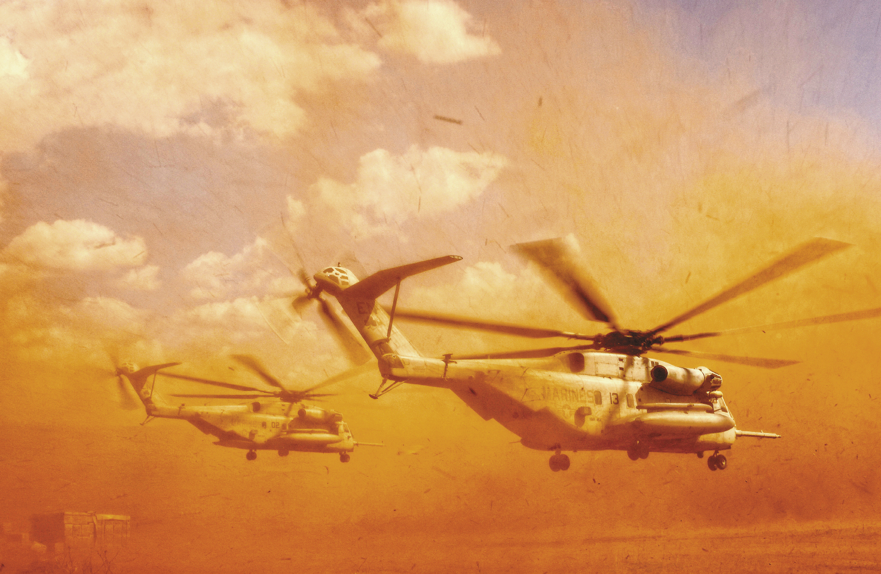 November 20, 2005:  A Marine CH-53E helicopter from the 464th Alpha Company kicks up sand and rocks as it takes off in Harar, Ethiopia. There, sailors from the Navy Mobile Construction Battalion 3 have dug three wells and are staging to drill several hand-pump wells, which will be used to provide thousands of Ethiopians and their livestock with potable water.