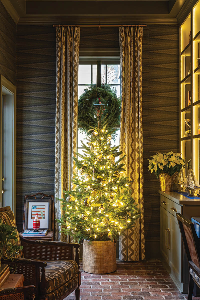 In place of a wobbly tree stand, John uses a plastic bucket with a 12-inch PVC pipe, wide enough to accommodate the trunk, cemented in the center. He then covers the base with fabric and fills it with water to keep the tree hydrated.