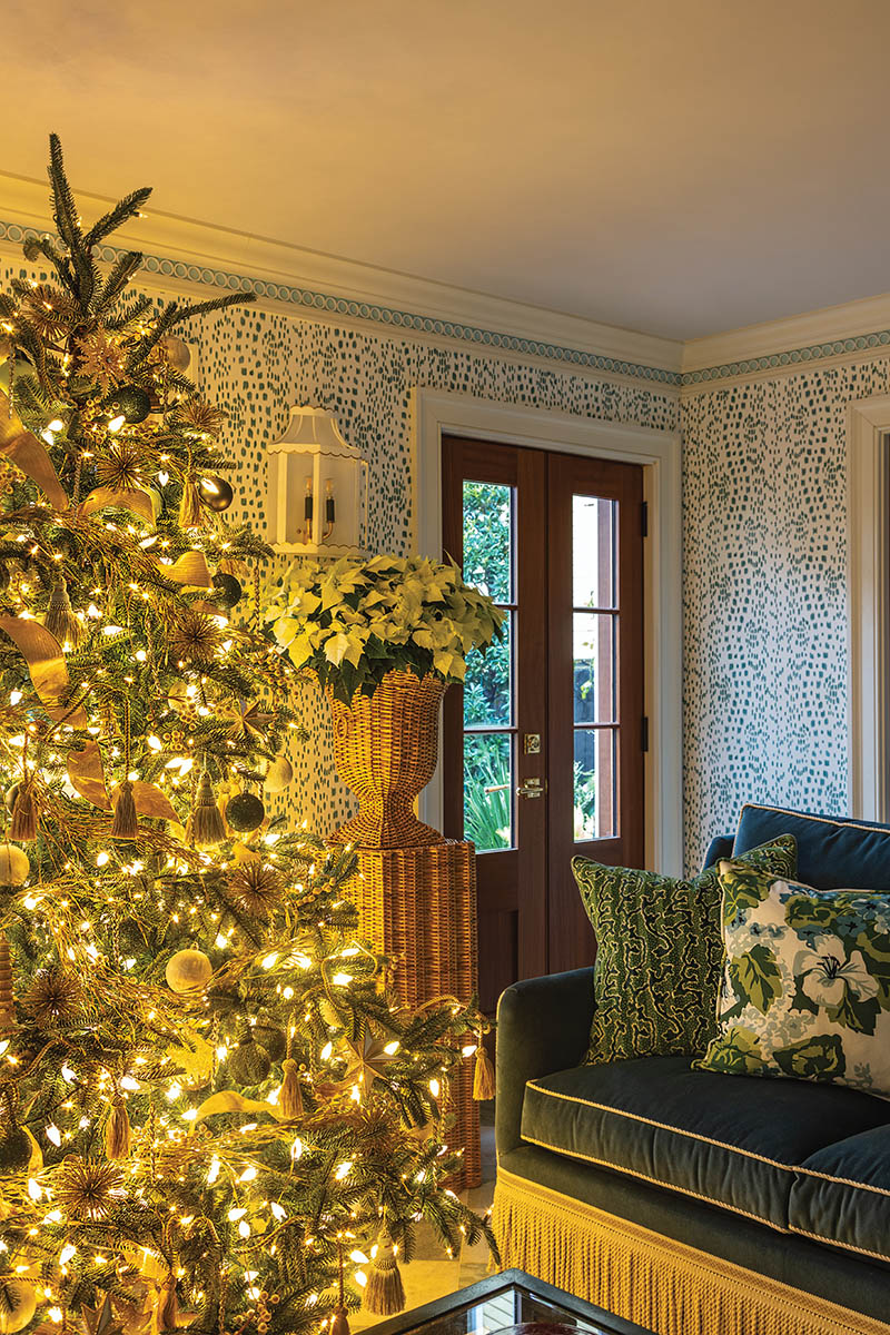 As the pool house has a more relaxed feel, John wanted its nine-foot tree to be a little more whimsical, draping it in a gold garland that reminds him of seaweed and adding decorative tassels from Samuel &amp; Sons.