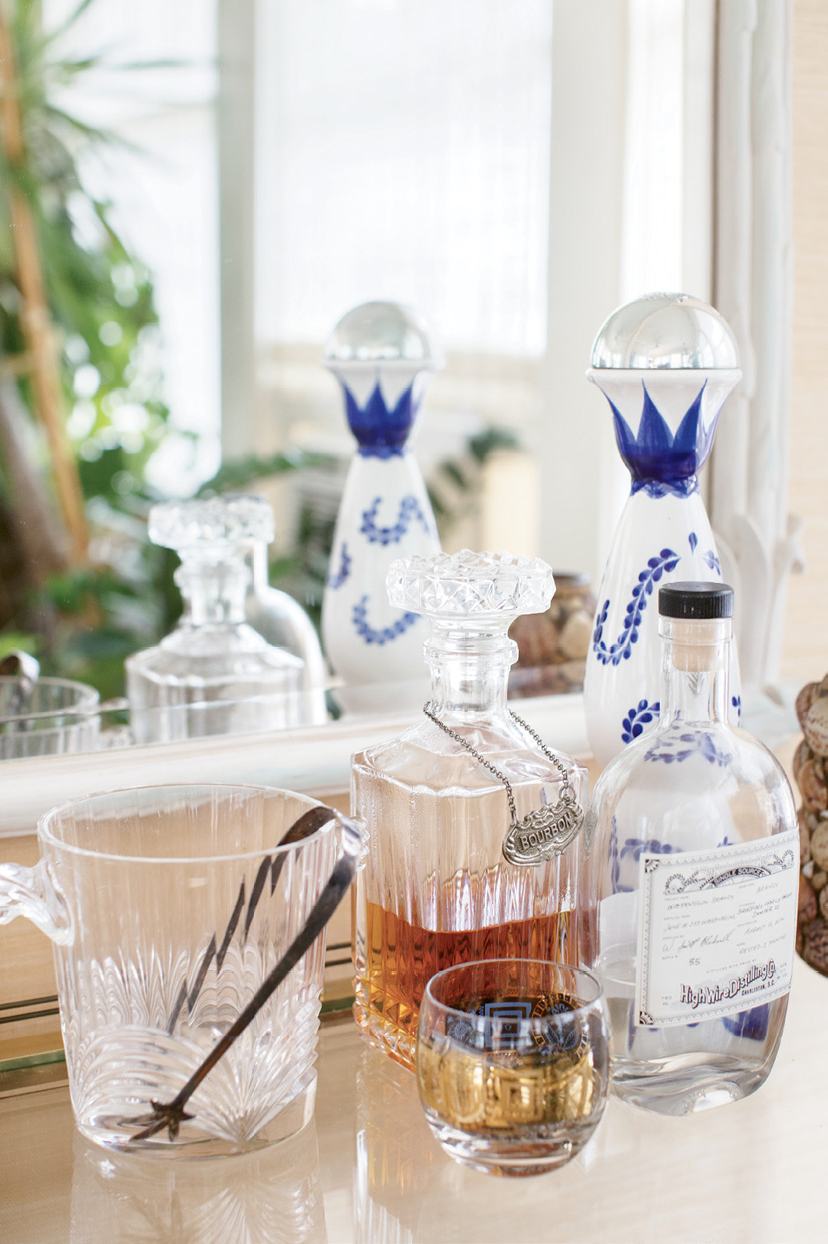 Cocktails and conversation flow in the welcoming home of Dr. Melvin and Deborah Brown. He’s known for his cooking and mixology skills and she, an avid collector, dresses the eclectic interiors.