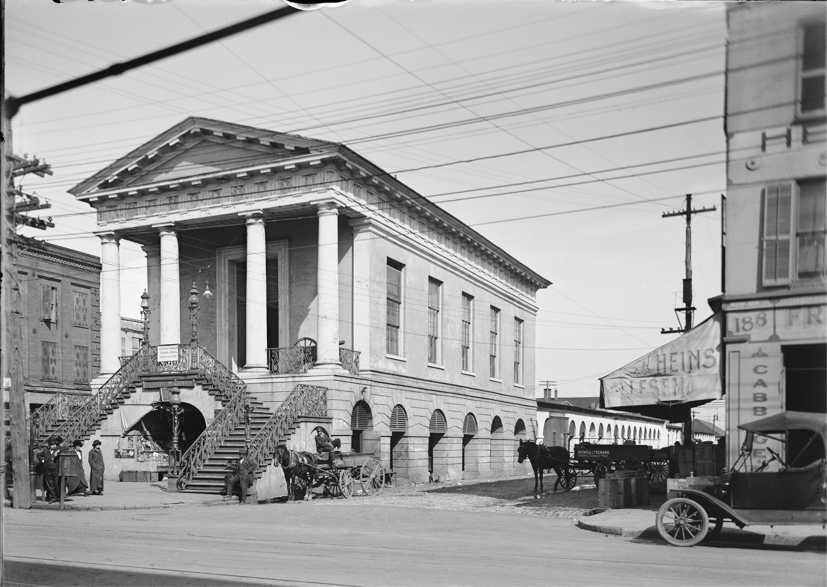 The 1910 Woodie truck parked on Meeting Street is perhaps more suited to Charleston’s narrow streets. Horse-drawn carriages still regularly round this busy corner carrying visitors touring the old city.