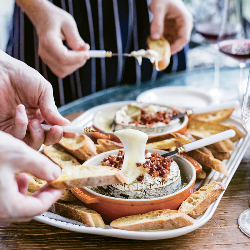 A soft cow’s milk cheese wrapped in spruce bark, Rush Creek Reserve is extra indulgent when baked with garlic and savory pancetta. If the cheese isn’t available (its typical season is November through December), Jasper Hill Farm’s Harbison, produced in Vermont, will also work.