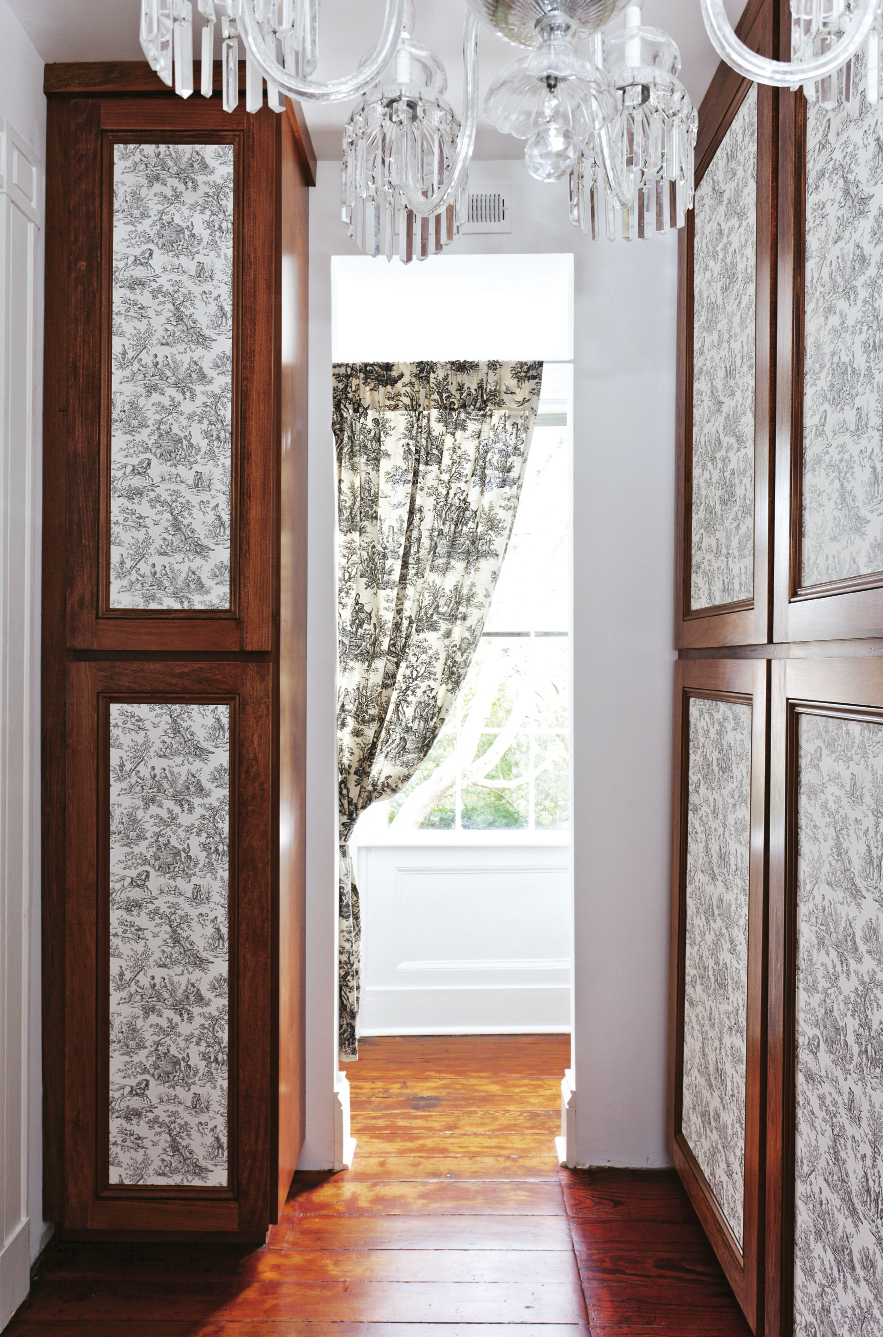 SENSING A PATTERN The pair covered cedar closet door panels in toile wallpaper.