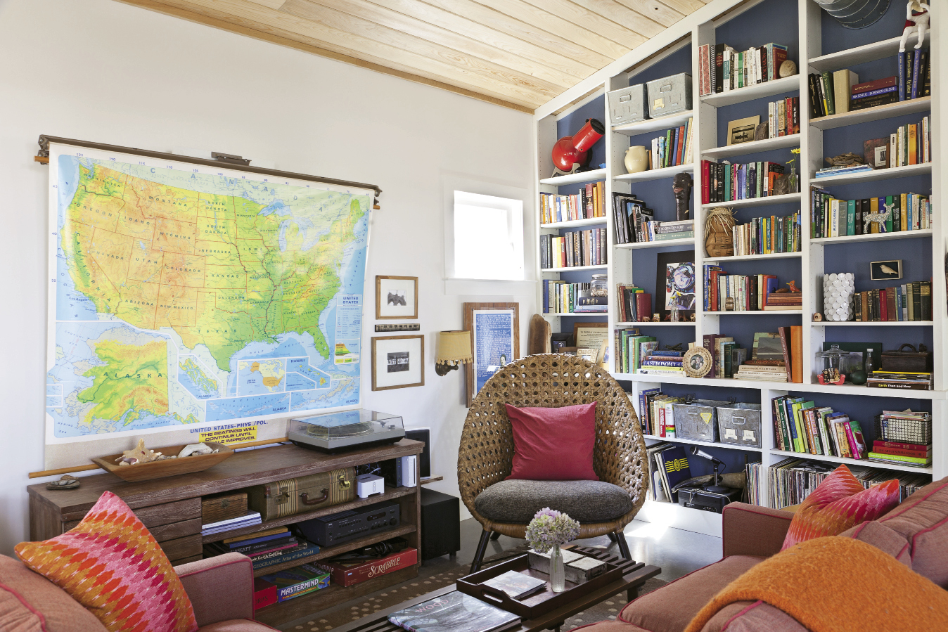 Shed roofing allows for ceilings that soar up to 14 feet in the living room; built-in shelves nod to the space-efficient houseboats that inspired the family to downsize.