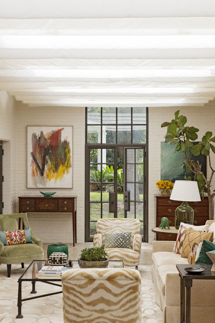 sun catcher: With its glass ceiling, brick walls, and concrete tile floors, the sun porch is architect Bobby McAlpine’s update on the sunken dens found in many mid-century homes.