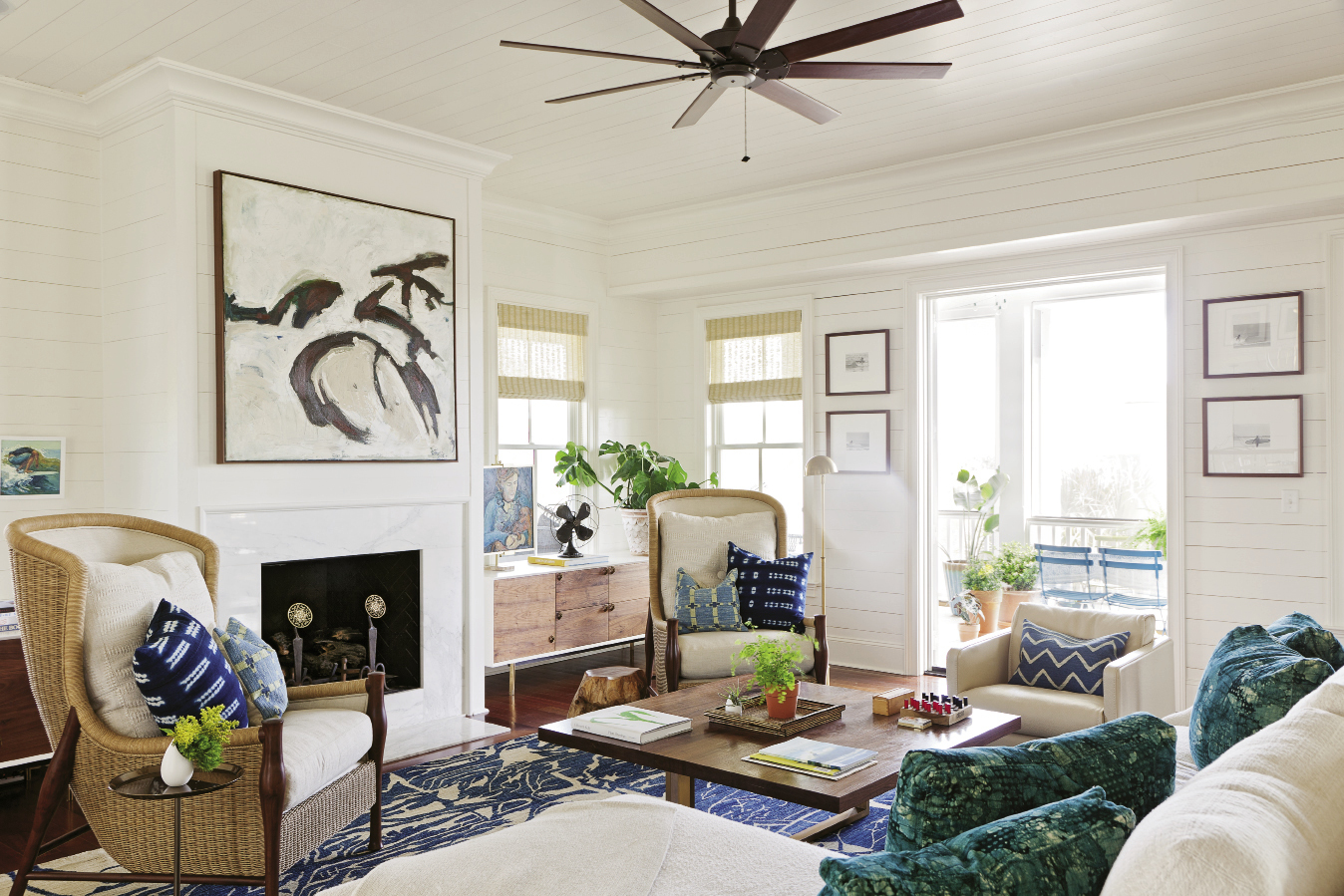 Lynne was inspired to create the painting above the fireplace after seeing her dog, Jasper, frolicking on the shore. “She’s always running and jumping,” she says. “This is an abstract expression of her movement.”