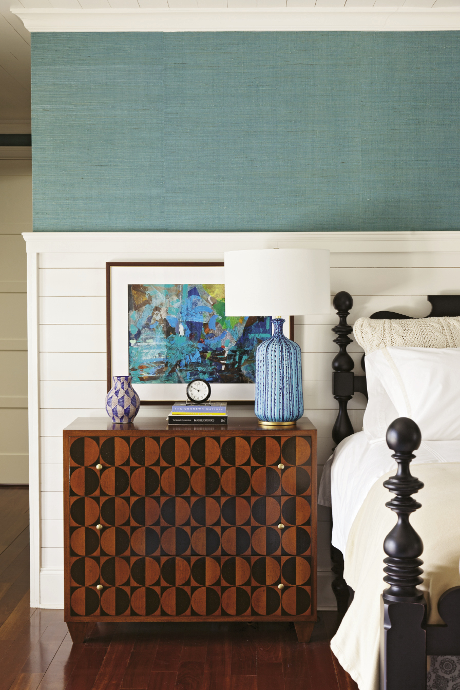 Walnut and mahogany bureaus add graphic punch in the master bedroom.