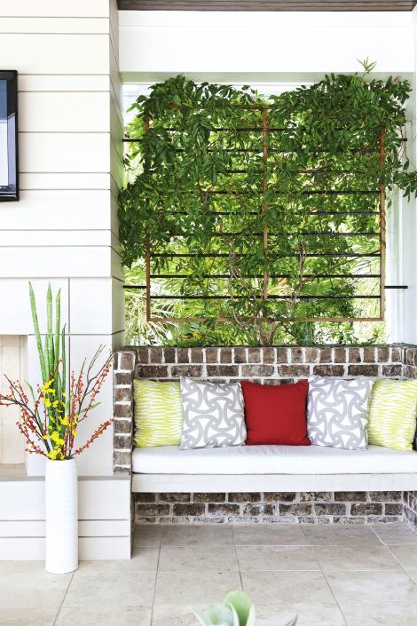 The fabric for the throw pillows on the built-in seating is by Trina Turk for Schumacher.