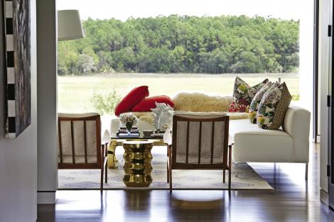 The Louis XVII-inspired chairs are upholstered in white vinyl.