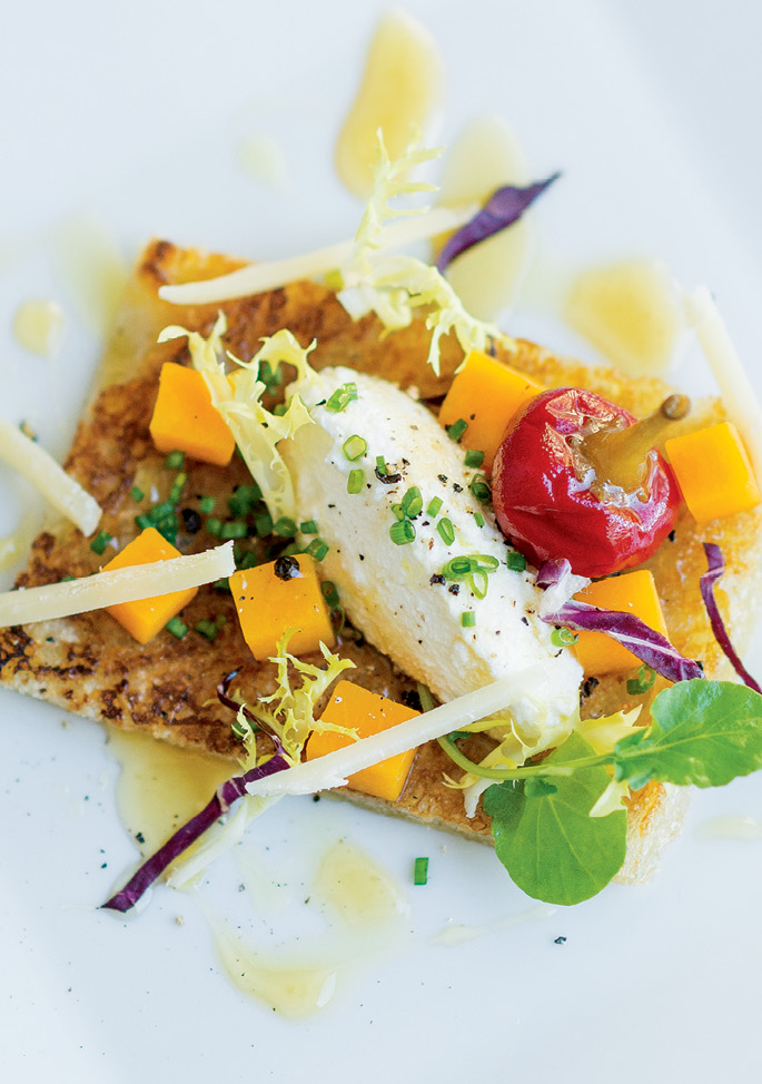 For Starters: Scattered greens, a pickled pepper, squash pieces, and shaved Pecorino add color and texture to Vedrinski’s winter squash and sheep’s milk ricotta bruschetta.
