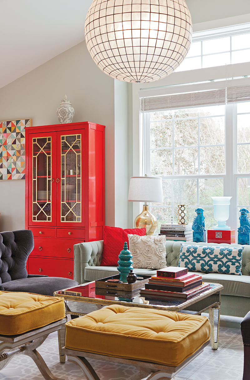 Sally found the living room cabinets at Ikea and put her skills to work, lacquering them and adding the fretwork panels, which she also gilded. The couple first spied chandeliers like the globe made of capiz shells while travelling in Boracay; she sourced this one from Restoration Hardware.