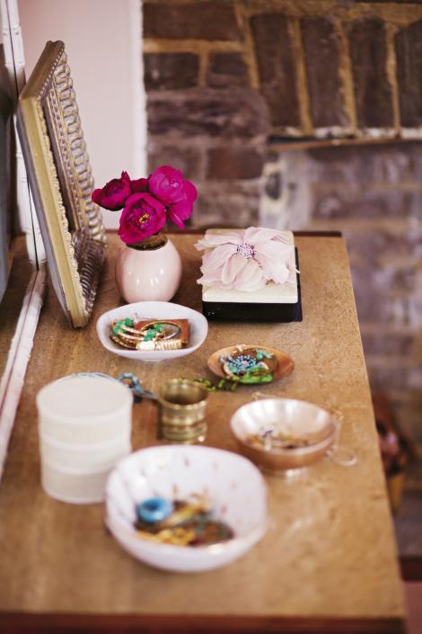 A vintage Baker dresser holds a collection of curiosities in the master bedroom.