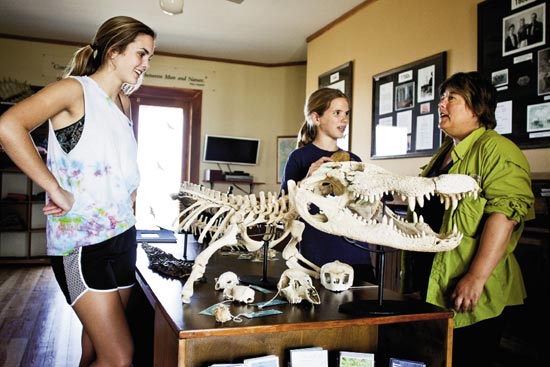 Sally (left) and Claire (middle) make a pit stop at the Nature Center, featuring a touch-tank, a live turtle exhibition, and info on barrier island ecosystems, including gator orthopedics.
