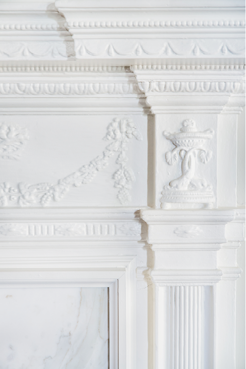 Adamesque-style woodwork was added to mantels in the late 1920s, as was the dining room chandelier—likely Waterford.