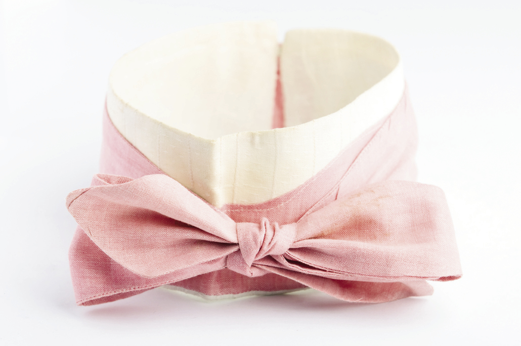 HIGH COTTON These early 20th-century cotton ties came with collars. The purple one bears the stamp: “The Corsair. / Patent Feb. 18, 1900” and has a buttonhole for attaching to the shirt. A slit on one side allows the tie to wrap around the neck, making it adjustable.
