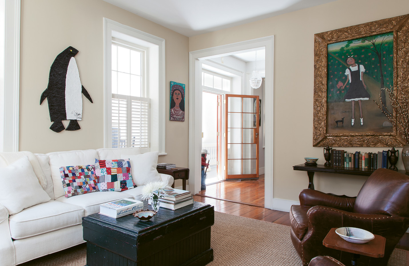 A coffee table made out of beadboard epitomizes the couple’s laid-back, Americana style. “It’s been painted five times and scratched up; you can put your feet on it,” Ann says. “The running theme to everything we do is approachability.”