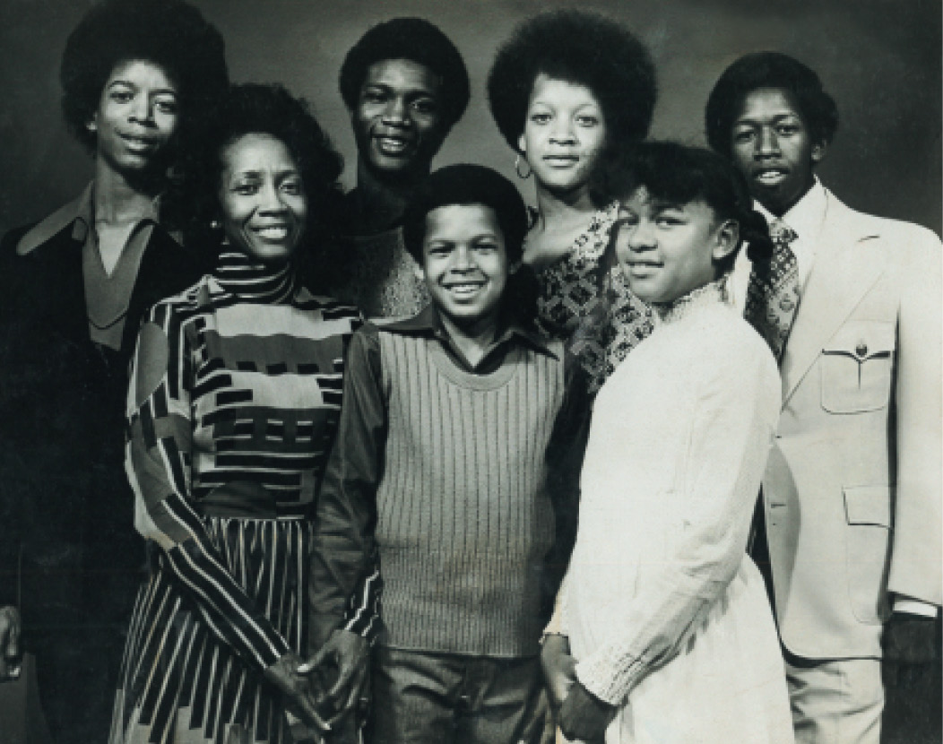 A proud mom with her six children (left to right) Ralph, Stanley, Darryl, Adrian, Jami, and Gerald