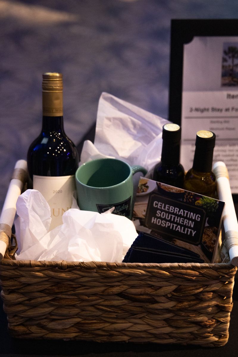 Silent auction items were sourced from multiple local businesses, including Estelle Colored Glass, Brackish, and Taxidermy.