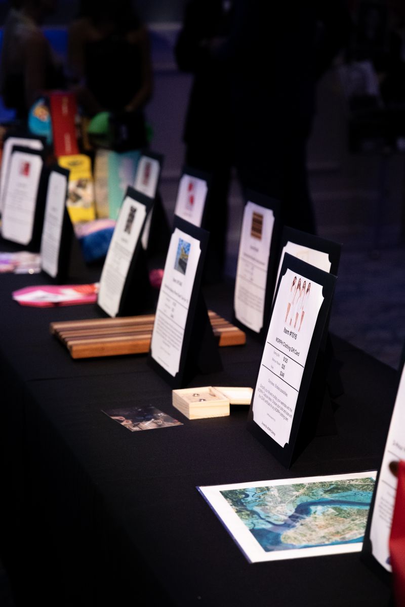Silent auction items were sourced from multiple local businesses, including Estelle Colored Glass, Brackish, and Taxidermy.
