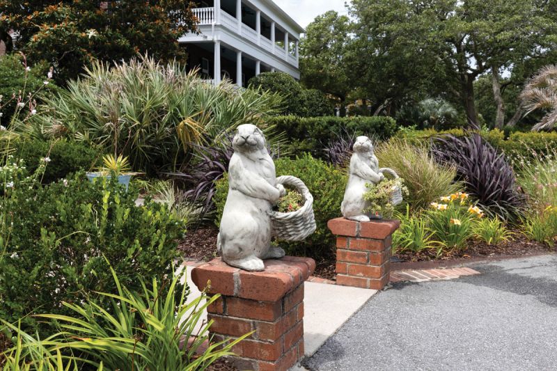 Rabbit statues stand sentry by the front walkway.