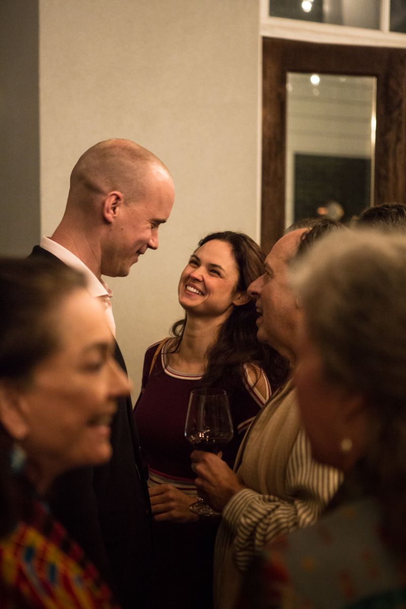 Guests mingle before sitting down for dinner.