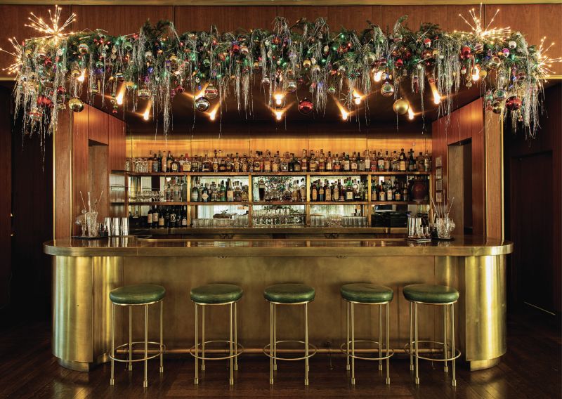 ...retro tinsel, lights, and ornaments at the bar...