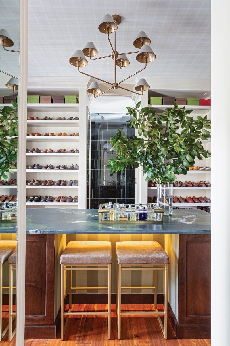 Said closet resembles a high-end men’s store and stows everything from Will’s sunglass collection to luggage. “I’m very big into ‘everything in its place,’” John says.