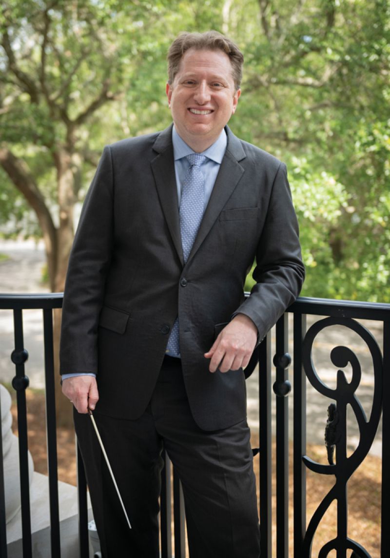 CSO concertmaster, artistic director, and principal pops conductor Yuriy Bekker outside the Gaillard Center; (opposite) the rare 1638 ‘ex-Degen’ Andrea Guarneri violin, purchased by an anonymous patron for Bekker to play during performances.