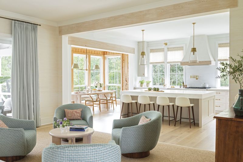 Sit a Spell: Four swivel “chat chairs,” as Elebash calls them, provide overflow seating for get-togethers. ”It became its own little seating area, but you can also easily talk to people in the dining area, kitchen, or living room—it works for all three locations,” she notes.