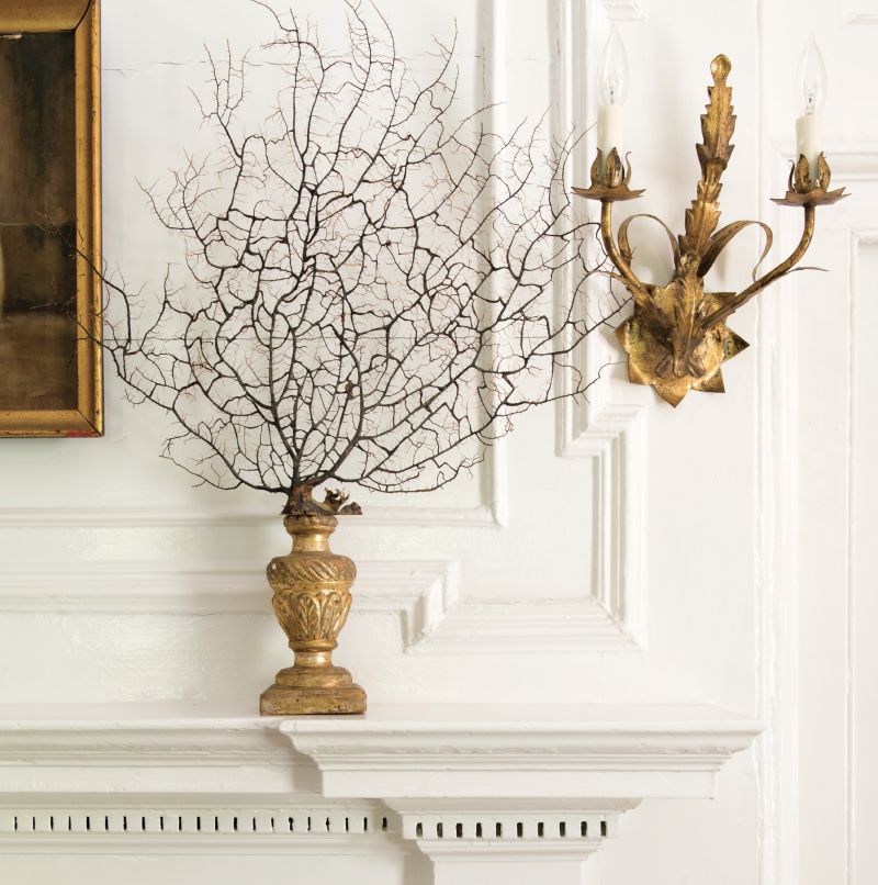 Simple overmantel detailing in the Georgian style complements the restrained mantelpiece in the paneled drawing room of the Williman House, constructed in the late 1780s.