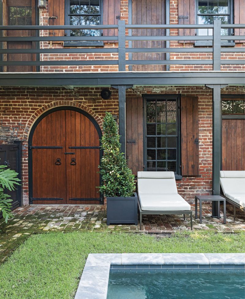 Glorious Garden: Protected by a Historic Charleston Foundation exterior easement, the original carriage/kitchen house has been restored to its former glory. A concrete staircase that once obscured the brick building has been removed allowing the mid-century Loutrel Briggs-designed garden, restored by Glen Gardner, to breathe once more.