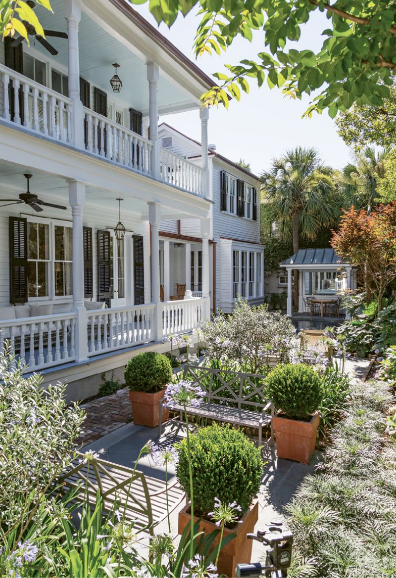 GARDEN ROOMS: Landscape architects Wertimer + Cline divided the long, narrow garden into several rooms relating to the different facades of the house and pool. They incorporated boxwoods, olive trees, giant taros, and other warm-weather plants into the design.