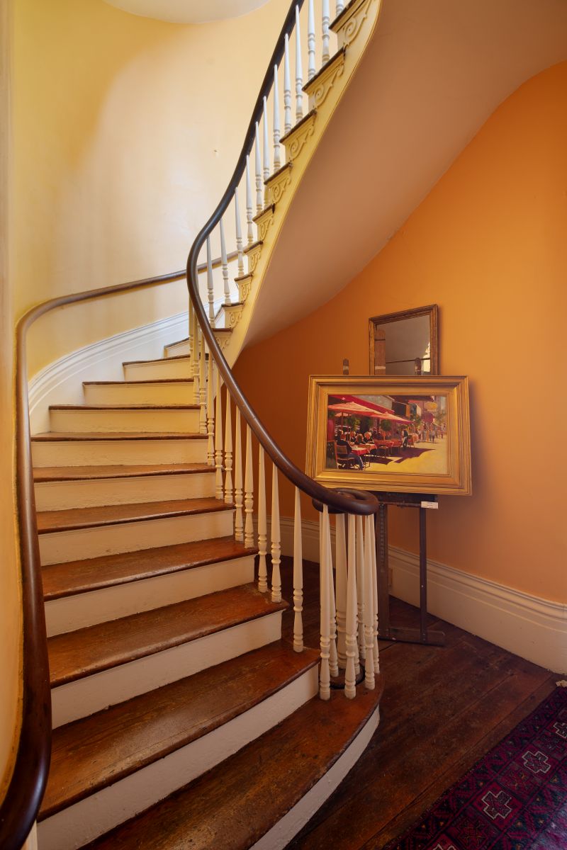 She fully restored the four-story home, regaling in its high ceilings and original heart pine floors and transforming the second floor’s front room from a battleship gray office with cubicles into her airy studio with ideal lighting.