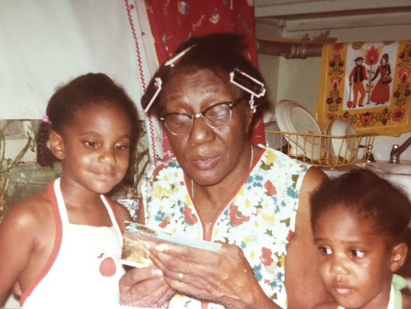With her great-grandmother, reading Tonya and Rochelle a recipe card; “I’m the one paying attention,” Matthews notes.