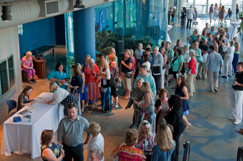 Guests mingled as they waited in line for a chance to speak with Monroe and have their books signed.