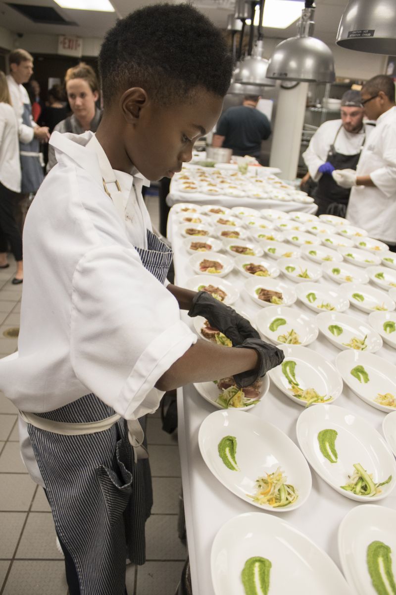 Jaylen Jones gets to work in the kitchen.