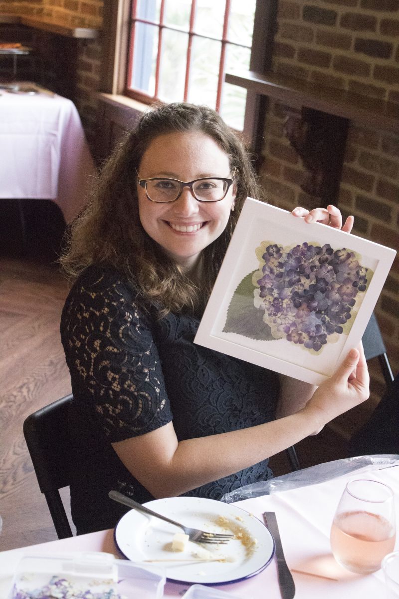 Alex Field poses proudly with her design.