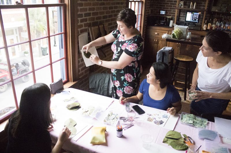 Lauren Whiteside Mann instructs Vanessa White and Marie Delcioppo.