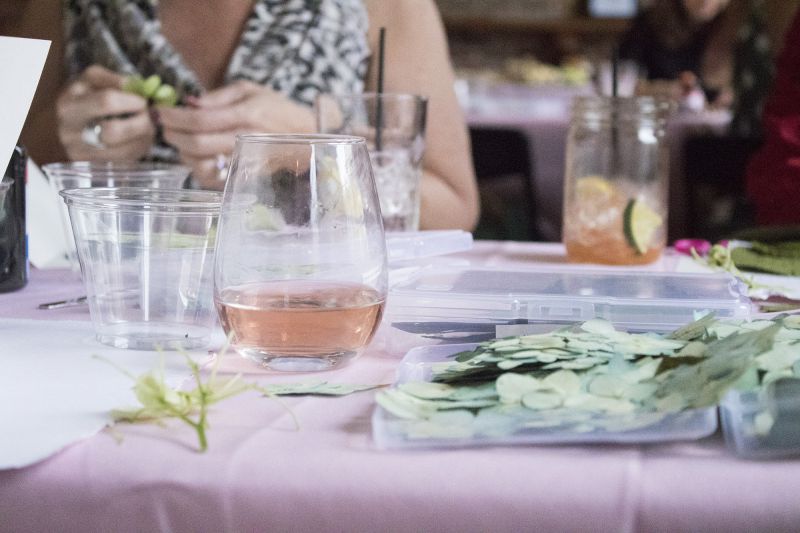 Rosé flowed freely for the flower pressers in training.