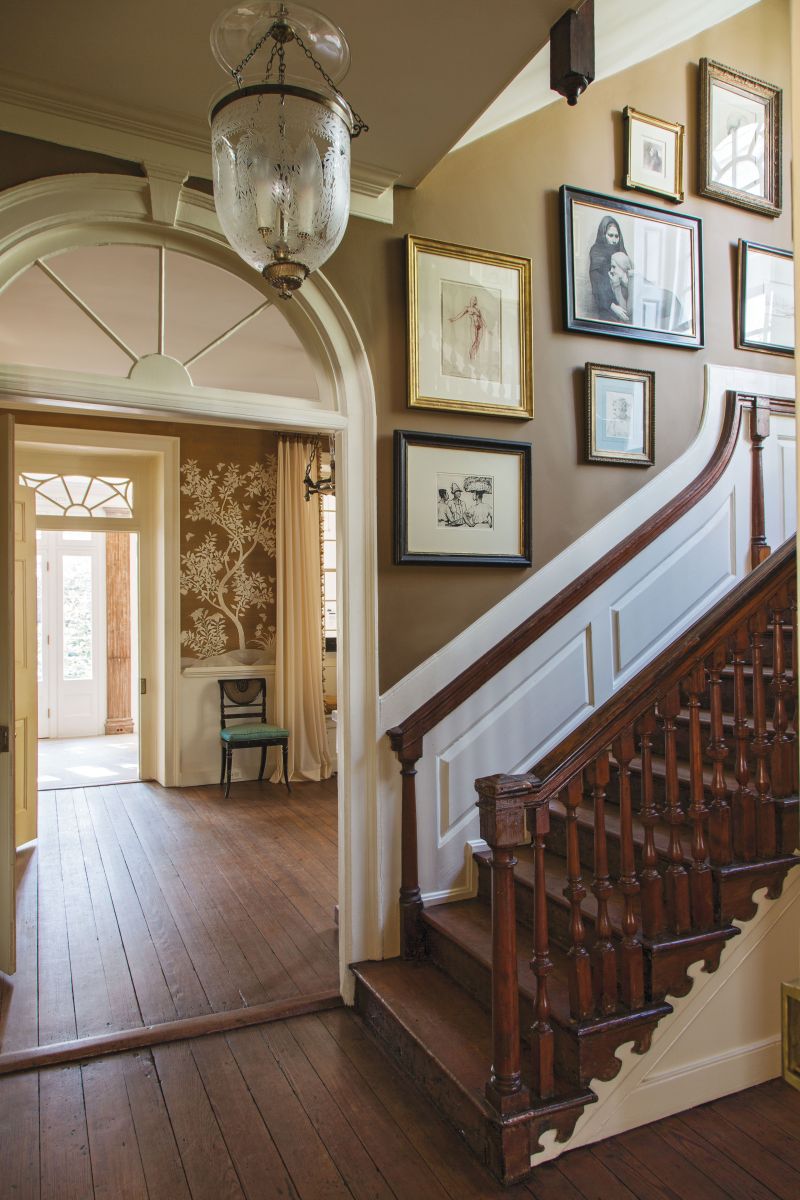 The walls of the stairwell double as a gallery, with pieces spanning the 18th and 21st centuries, including etchings by Alfred Hutty, a charcoal sketch by Italian artist Daniela Astone, and figure drawings by Ben Long, among many more.