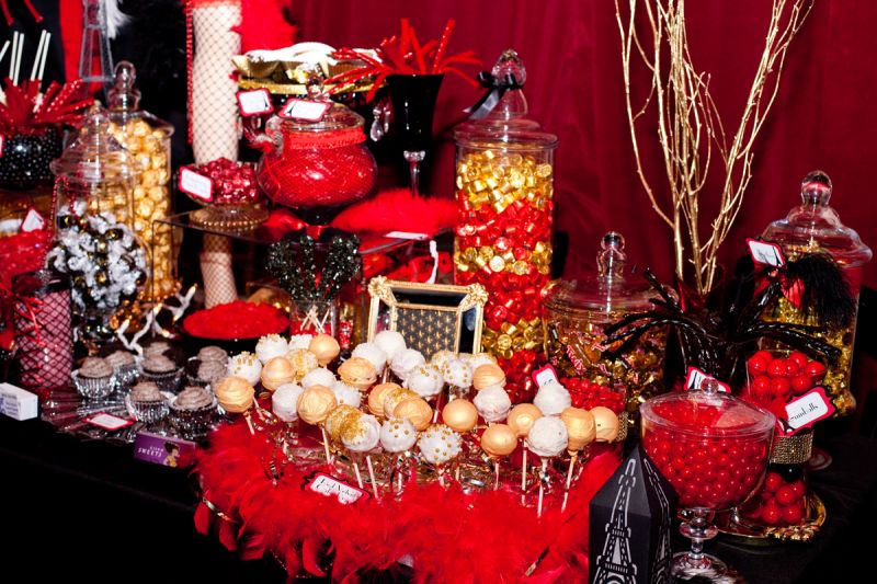The candy table by Candy Catered featured cake pops by Kisam Sweets.