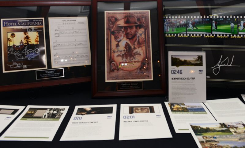 Signed “Hotel California” sheet music and an Indiana Jones poster signed by Harrison Ford, Sean Connery, and Steven Spielberg