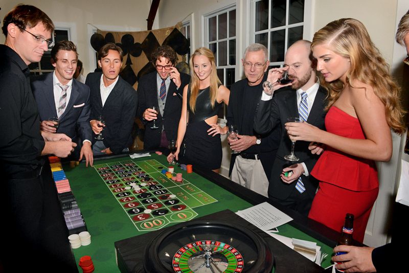 Guests crowded around the roulette table to watch the action or place some bets themselves.