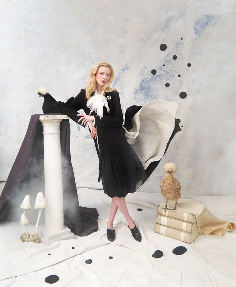 Splendiferous: Ash Holden “Portland” cloak in cotton and linen, $1,368, Ash Holden organza and obsidian beaded necklace, $418, and Krista Larson “Farm Slip,” $488, all at Havens; Moroccan slides, $35 at Out of Hand; Marco Dominici bee pin, $160 at The Hidden Countship; three-strand pearl bracelets with diamond clasps, $3,450 and $3,680 at Croghan’s Jewel Box; Peyton William “Lana” gold cuff ring with Labradorite, $150, and multi-stone wide band, $595, both at Peyton William Jewelry; props courtesy of (column, book boxes, and paper-mache mushrooms) Alexandra AD; (Polish chickens) All Thing Acre Petting Zoo