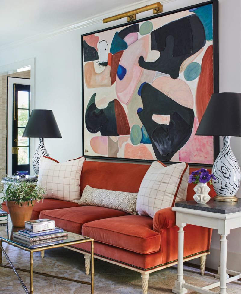 Make a Statement - A large-scale abstract painting by local artist and jewelry designer Hart Hagerty stuns in this Riverland Terrace living room. The art sits amid a vignette reflective of the home at large—a vibrant space where antiques mingle thoughtfully with modern art.