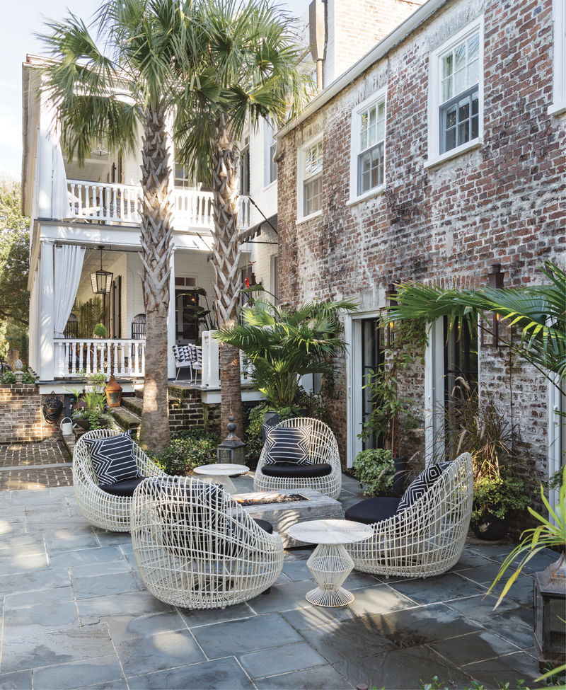 Sit a Spell: A spacious bluestone patio and luxurious Janus et Cie lounge chairs invite relaxation around the gas fire pit...