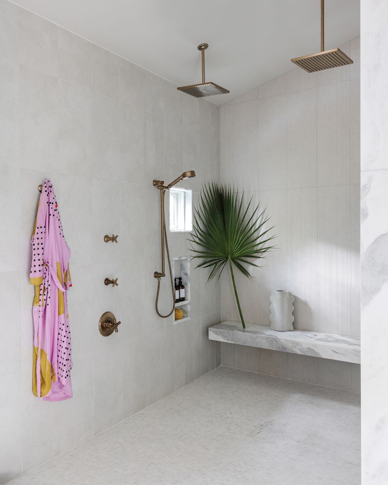 The Walker Zanger-tiled shower offers a spa-like experience.