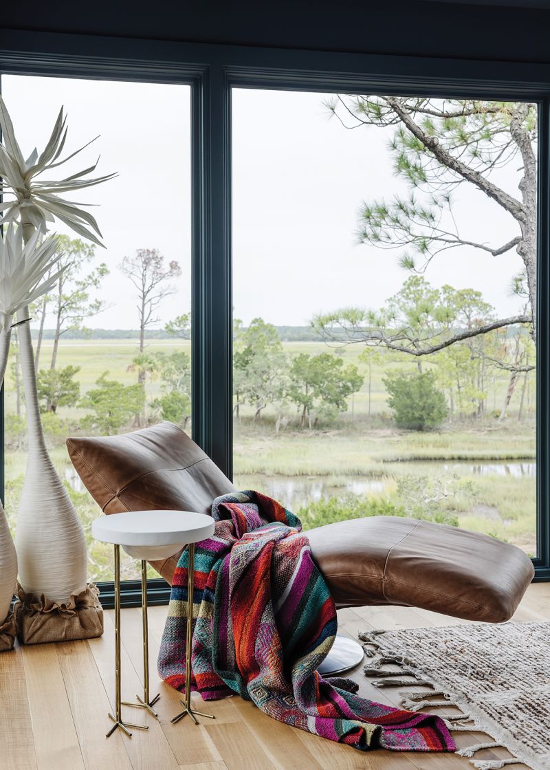 The upstairs includes three carefully curated rooms ideal for curling up with a book from the couple’s library and soaking up the view.