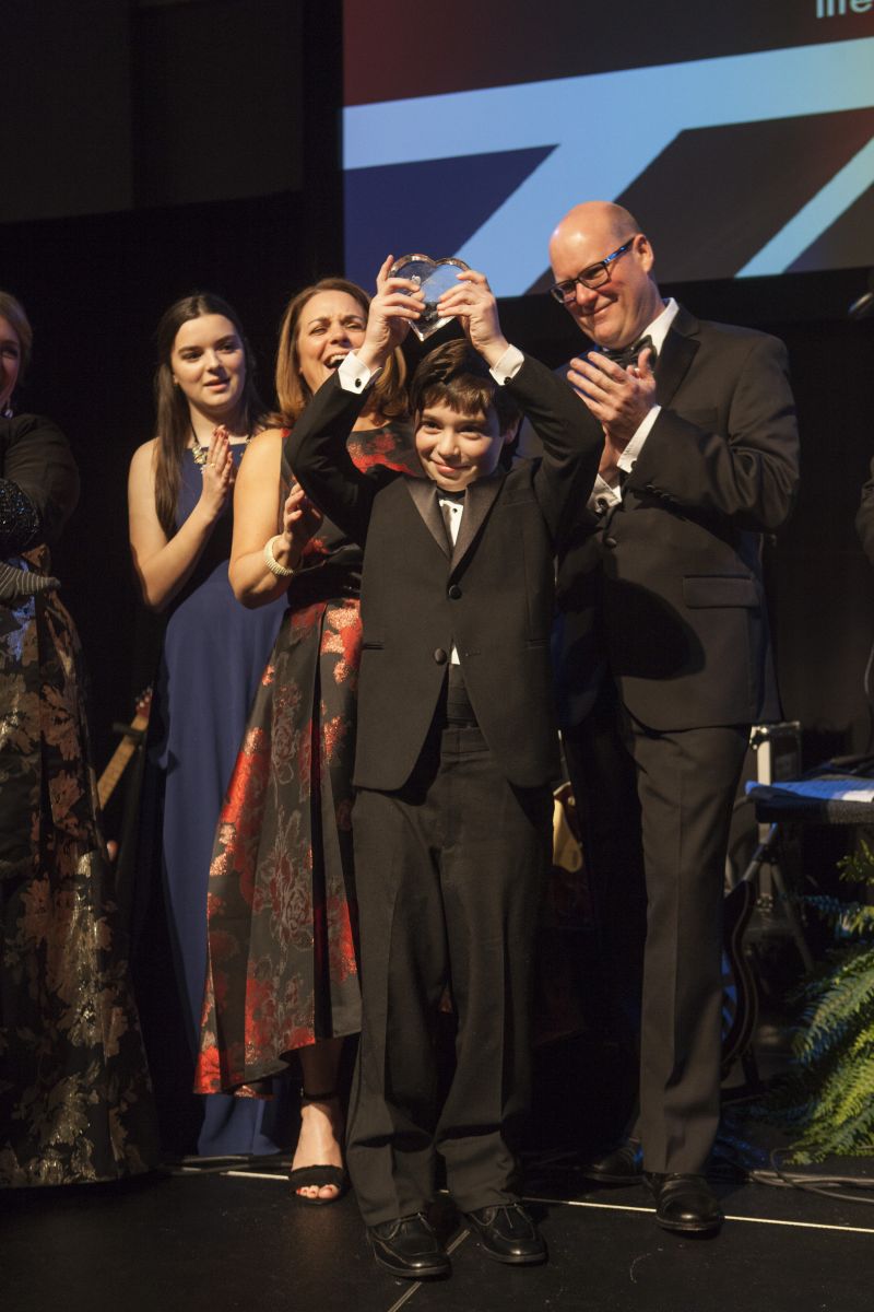 Ben Burkholder receives one of this year’s Open Your Heart awards.