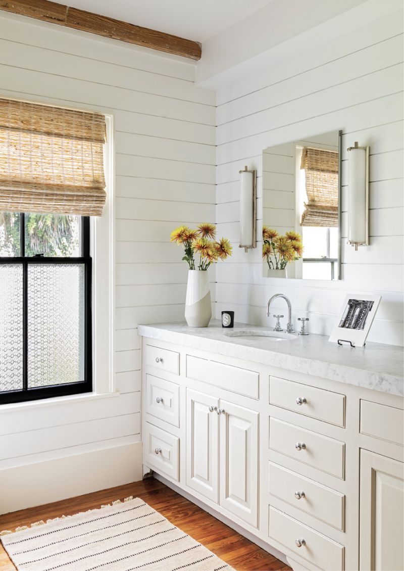 The bathroom was redone as part of the recent renovation, including adding a wall behind the vanity. Previously, it was open to the adjoining room where the bathtub is.